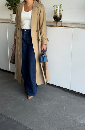 Beige linen trench coat with navy back panel and plaid details