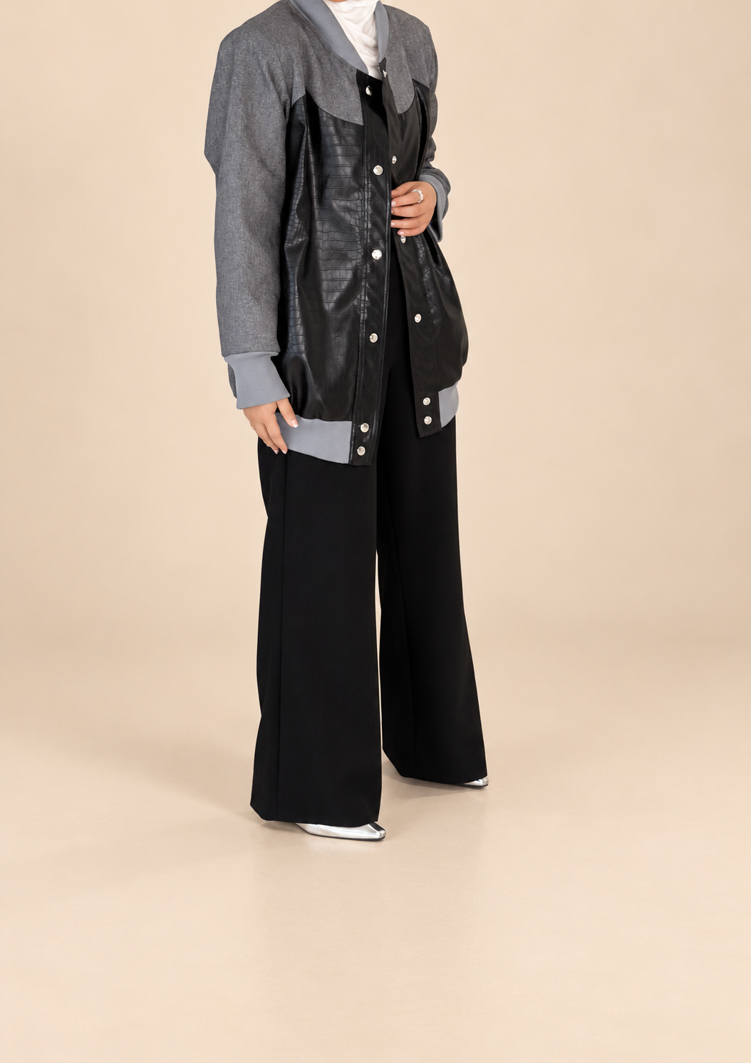 leathery black jacket – beige background
