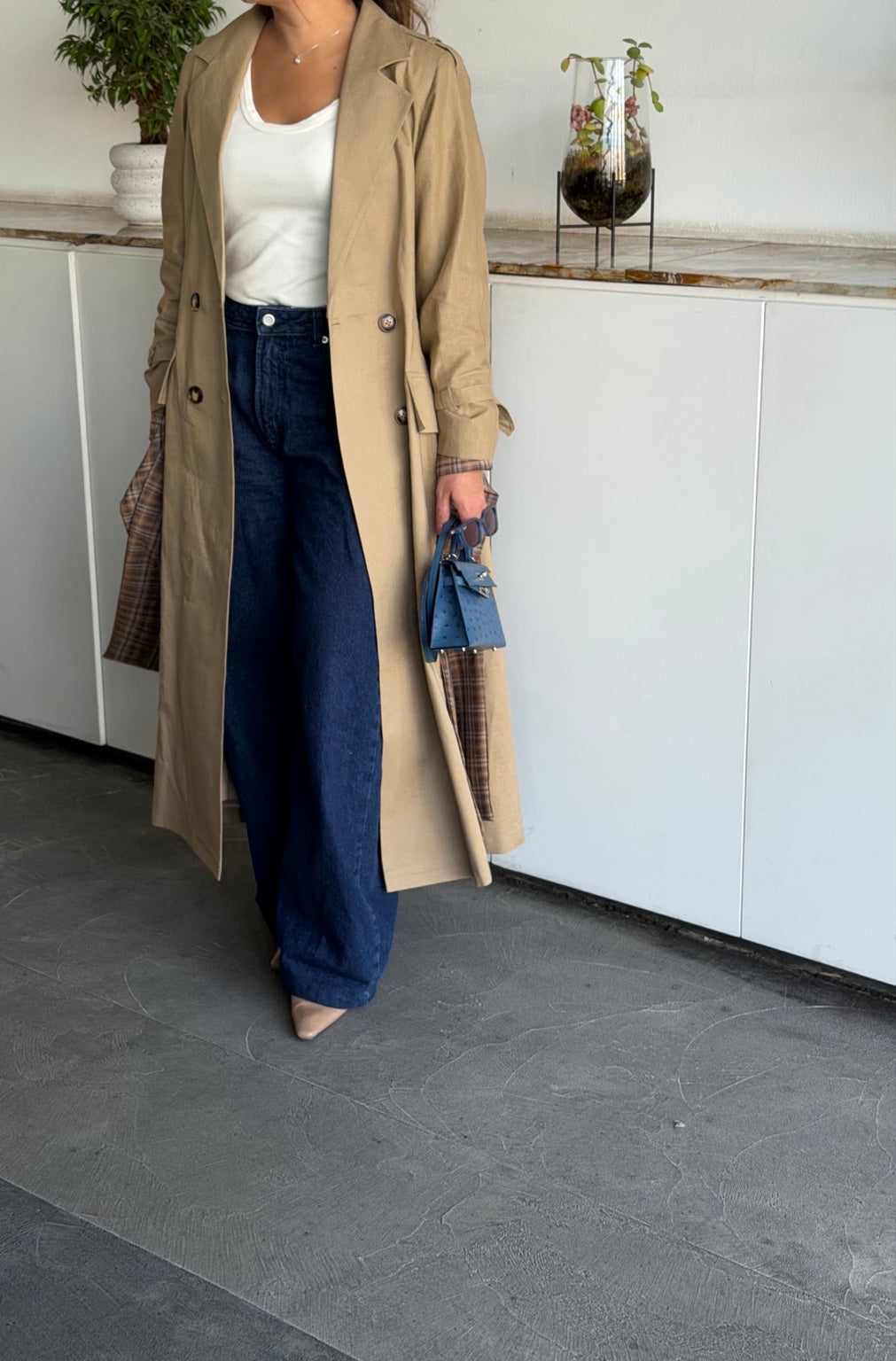 Beige linen trench coat with navy back panel and plaid details